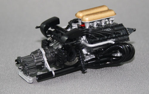 Engine and gearbox with some of the rear suspension attached. Here's a tip for anyone doing this kit: cement individual exhausts into the collector first, then line them up in the engine block – not the other way around! As 